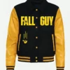 Ryan Gosling "The Fall Guy" Carpool Karaoke Black and Yellow Varsity Letterman Jacket Introducing the Fall Guy Ryan Gosling Carpool Jacket, a stylish blend of modern fashion with a touch of nostalgia. Inspired by the fun scenes from "Carpool Karaoke" and worn by Ryan Gosling, this varsity letterman jacket captures the relaxed and adventurous spirit of his character. Perfect for casual outings, music festivals, or a cool evening in the park, this black and yellow jacket connects you instantly to the movie’s vibrant vibe. Distinctive Features with Eye-Catching Appeal This Ryan Gosling Carpool Karaoke Jacket is all about quality and style. The outer shell is made from high-grade wool, offering warmth and durability, while the bright yellow PU sleeves add a striking contrast. Inside, the jacket is lined with soft material for all-day comfort. The front features a classic button closure, making it easy to wear, complemented by a shirt-style collar and rib-knit cuffs that enhance its timeless varsity appeal. The jacket also includes two midline pockets accented with yellow borders, providing both style and practicality. The black body of the jacket is highlighted by yellow stripes on the hem and cuffs, and the "Fall Guy" print on the chest and back adds a unique, eye-catching touch. Effortless Style and Versatility Styling this black and yellow varsity jacket is both fun and easy. For a laid-back look, pair it with a simple white T-shirt and your favorite jeans, allowing the jacket’s vibrant colors to stand out. If you’re aiming for a cooler, more rugged vibe, try it with black jeans and boots. This combo enhances the jacket’s bold design. For a sporty feel, team it up with joggers and sneakers. To finish the look, add accessories like a cap or sunglasses for an extra touch of flair. However you choose to style it, this jacket will make you look effortlessly cool and confident. A Must-Have Wardrobe Addition The Fall Guy Carpool Karaoke Letterman Jacket is more than just a piece of clothing—it’s a statement of your style and personality. Whether you’re a fan of Ryan Gosling or simply love the jacket’s design, it’s a fantastic addition to any wardrobe. Put it on, head out, and let the world see your unique sense of fashion!